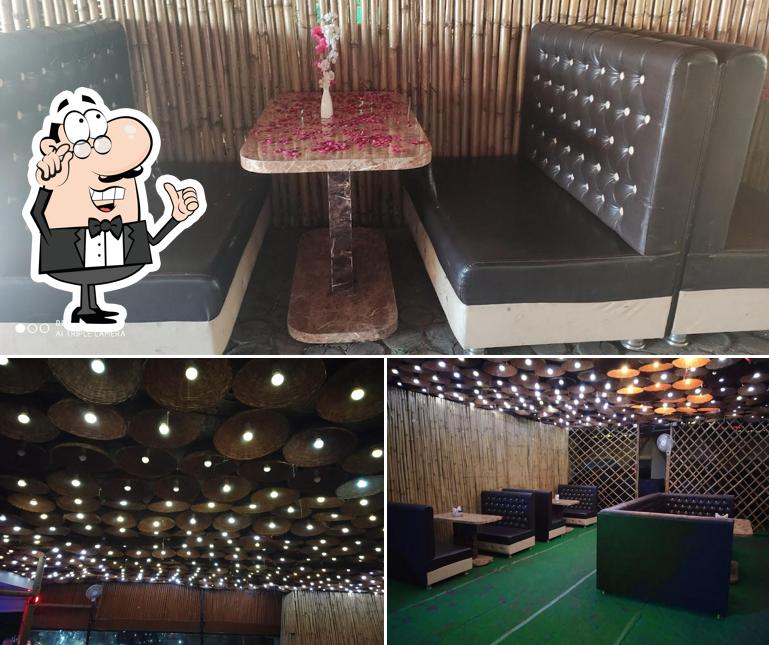 Take a seat at one of the tables at 24restro&cafe