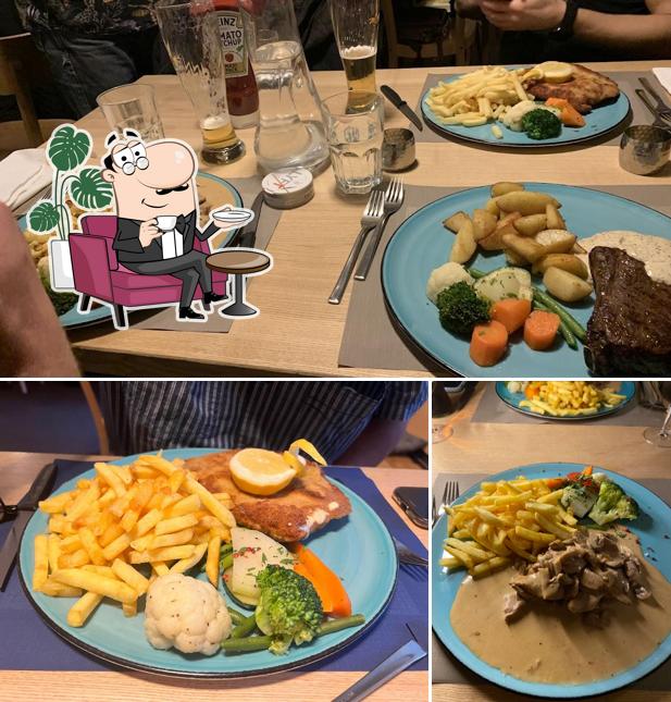 Questa è la immagine che mostra la interni e tavolo da pranzo di Köchlistube