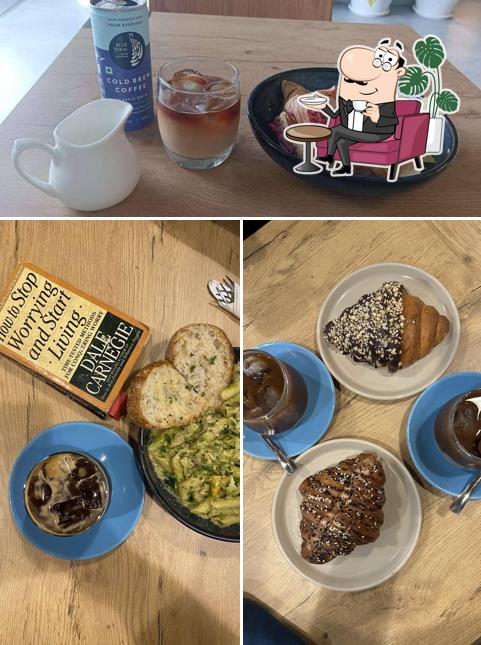 Take a seat at one of the tables at Blue Tokai Coffee Roasters NIBM Road