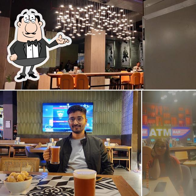 Take a seat at one of the tables at Atm Bar Mohali