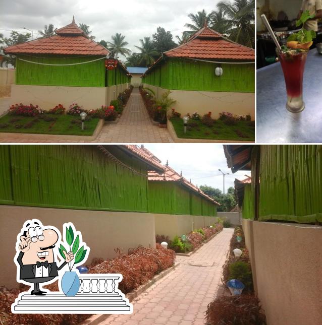 The photo of exterior and beverage at Kuteera Park Land Restaurant