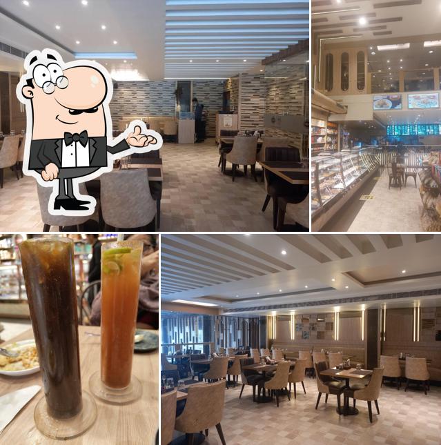 Take a seat at one of the tables at Rahul Sweets Panki Kanpur Restaurant in Panki