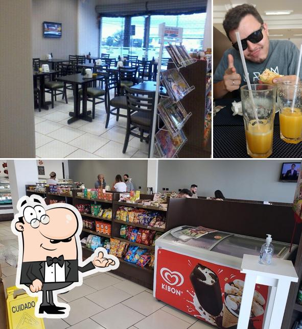 Entre diferentes coisas, interior e bebida podem ser encontrados no Confeitaria Florenze Pães e Doces