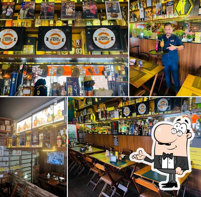 Sente em uma das mesas no Point dos Caldos Restaurante e Cachaçaria