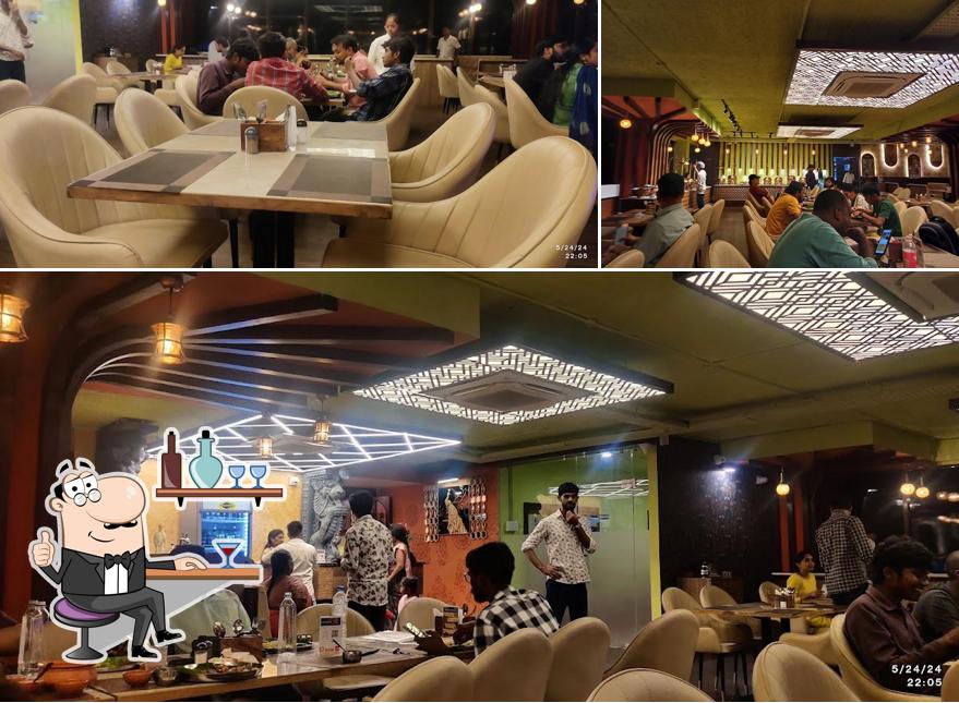 Take a seat at one of the tables at Samskruthi South Kitchen