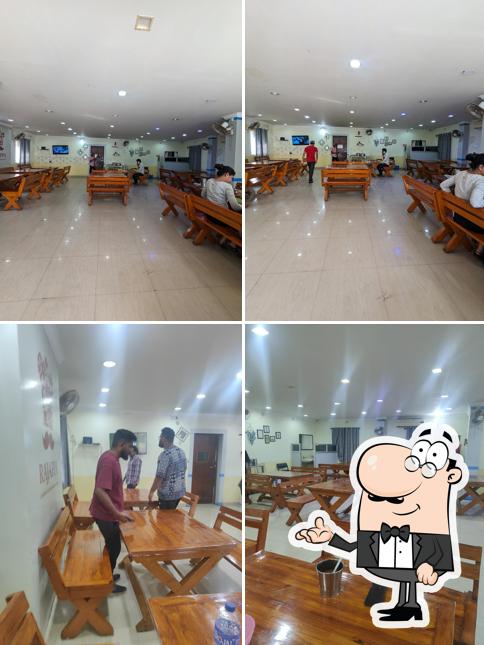 Take a seat at one of the tables at Rajappa Chettinadu Restaurant