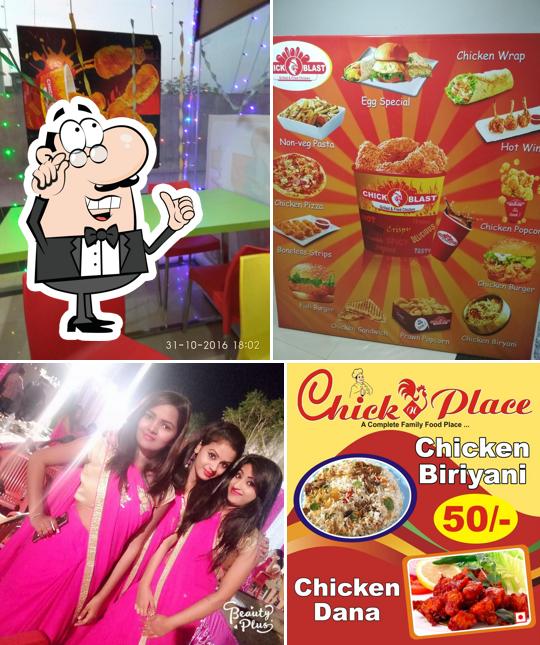 Take a seat at one of the tables at CHICK N PLACE