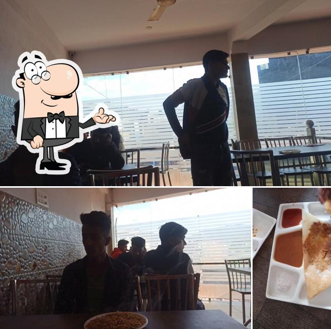 The interior of कामधेनू रेस्ट्रोरेंट