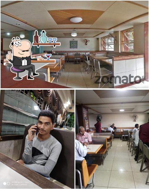 Take a seat at one of the tables at Chandan Restaurant