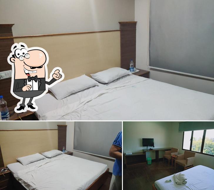 Take a seat at one of the tables at HOTEL PAMS