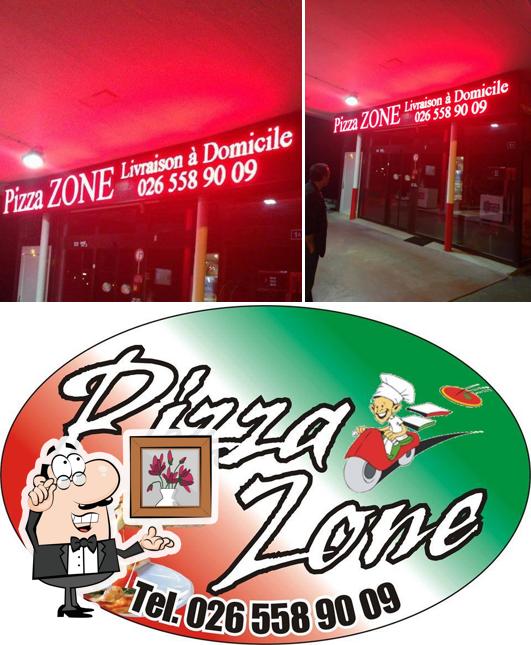 La immagine della interni e cibo di Pizza Zone
