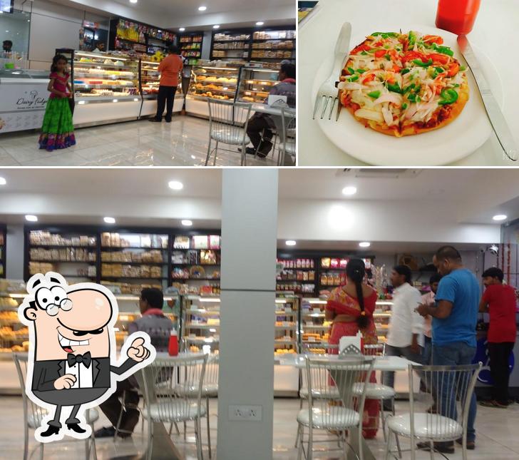 This is the image depicting interior and food at Alankar Sweets & Bakers