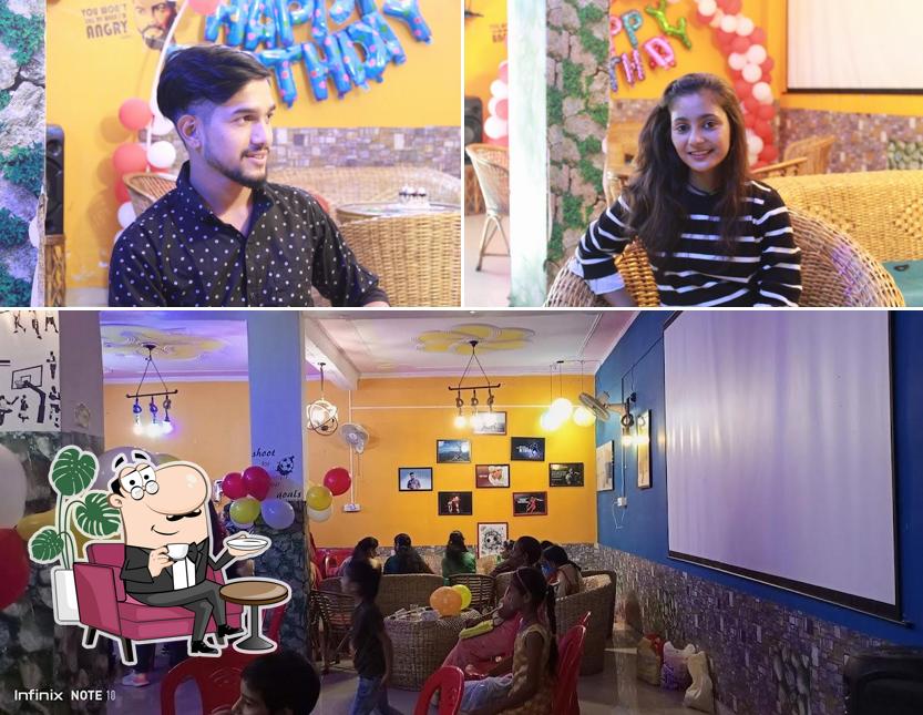 Take a seat at one of the tables at Rudra Cafe