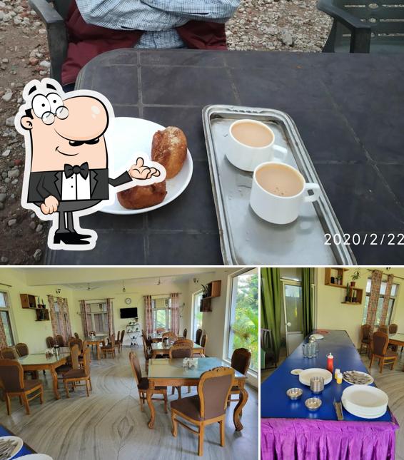 The photo of interior and food at Chilla Tourist Restaurant