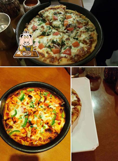 Get pizza at Sankalp Restaurant
