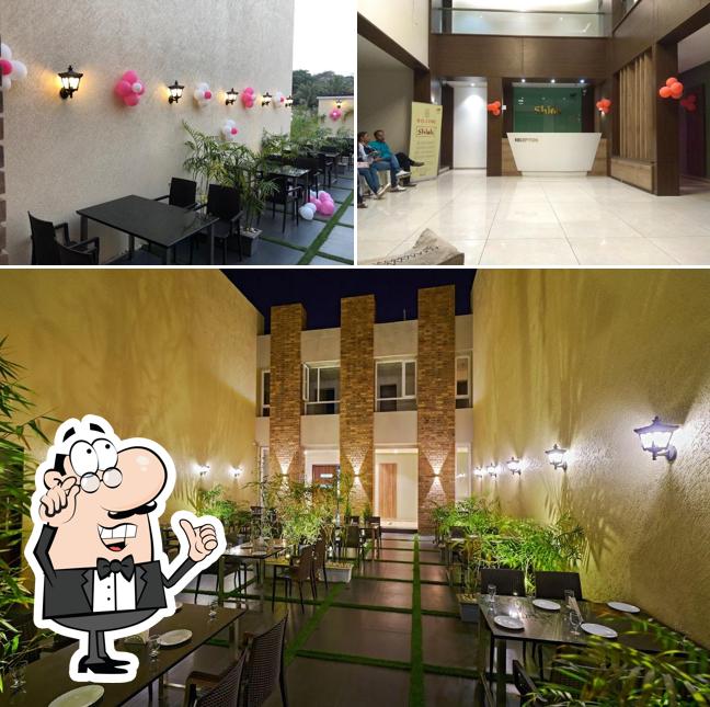 Take a seat at one of the tables at Hotel Shlok