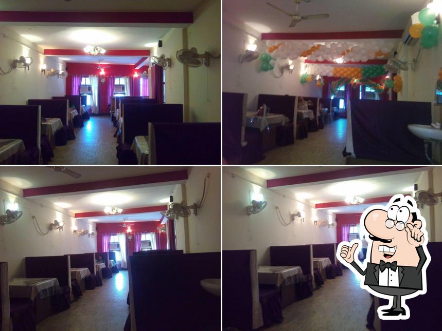 Take a seat at one of the tables at Rajmahal family restaurant Maunath Bhanjan