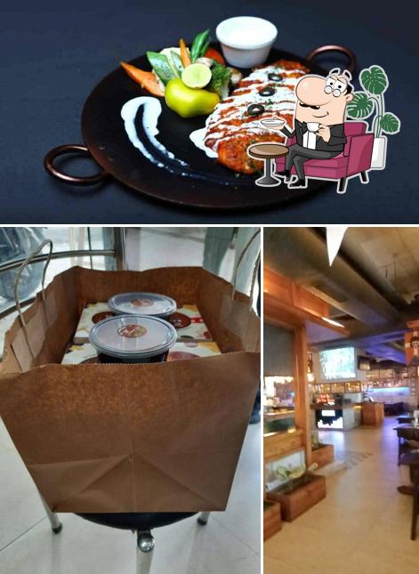 This is the picture depicting interior and food at Blue Pepper By Vapour B.E