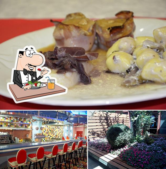 La immagine della cibo e esterno di Casinò Drive-in