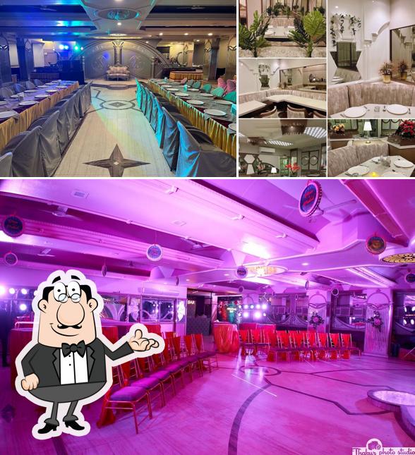 Take a seat at one of the tables at Regency Restaurant, Bar & Banquet Hall