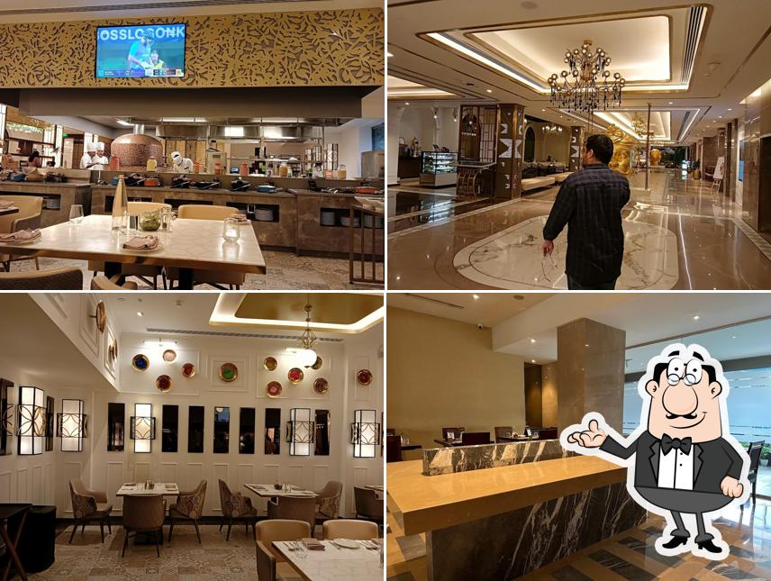 Take a seat at one of the tables at Oasis - Radisson Blu