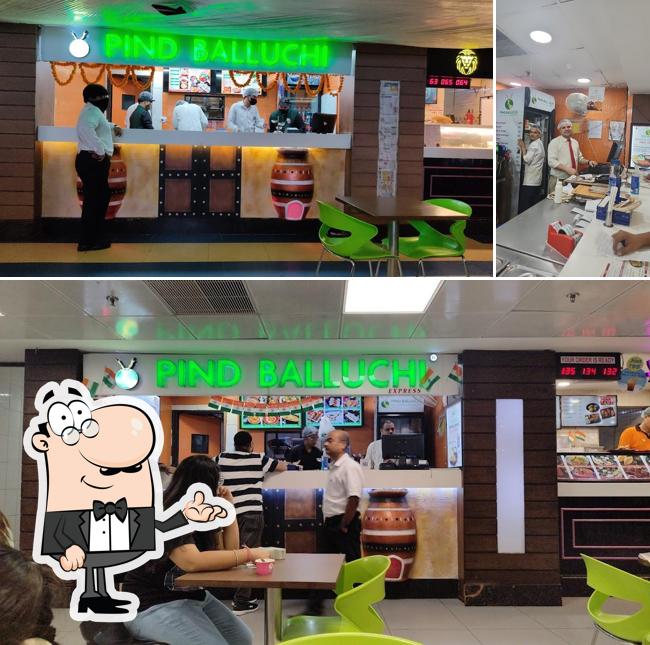 Take a seat at one of the tables at Pind Balluchi, MGF Metropolitan Mall