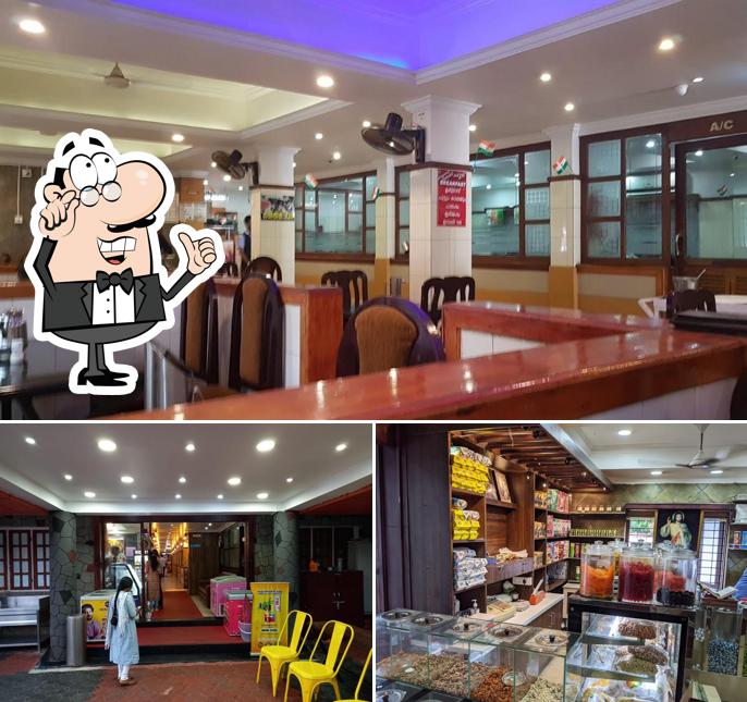 Take a seat at one of the tables at Hotel Annapoorna