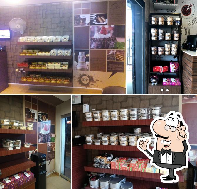 Take a seat at one of the tables at Cake Hut kaloor