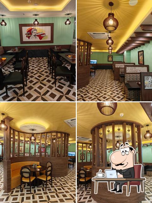 Take a seat at one of the tables at Dakshin Bhog - Jubilee Walk