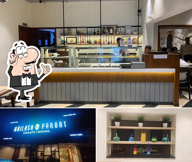 Check out the photo depicting interior and beverage at Kailash Parbat