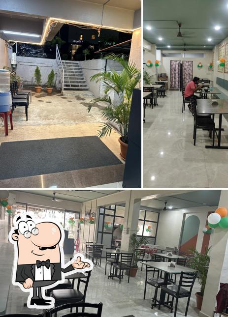 Take a seat at one of the tables at Shree Sai Bhoj