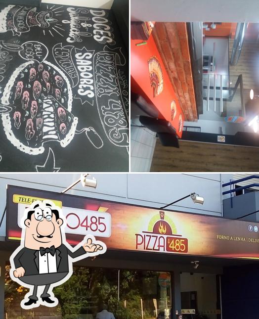 A imagem do Pizza 485’s interior e quadro-negro