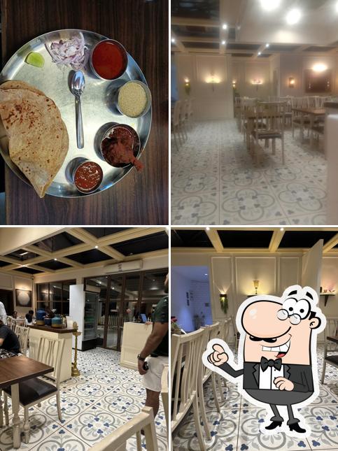 Take a seat at one of the tables at USHA Dining - Best Kolhapuri Mutton Thali Restaurant in Kolhapur