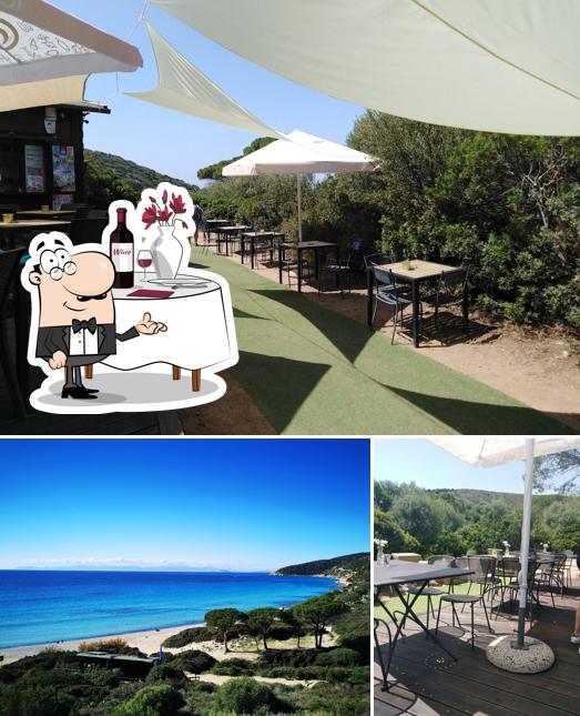 Questa è la foto che mostra la tavolo da pranzo e esterno di B-Stone Mari Pintau