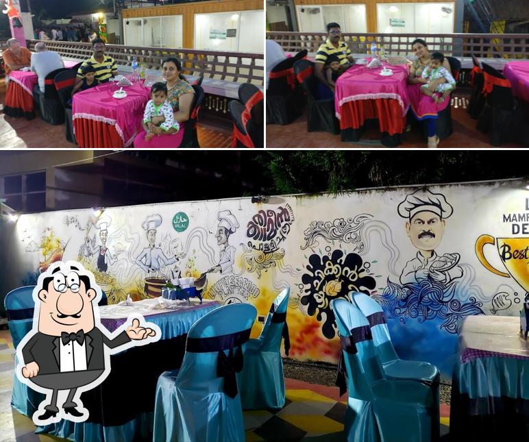 Take a seat at one of the tables at Lilliput Multi Cuisine Restaurant