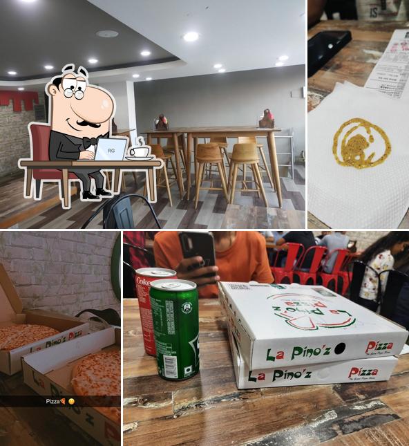 Take a seat at one of the tables at La Pino'z Pizza - 150 ft Ring Road Circle