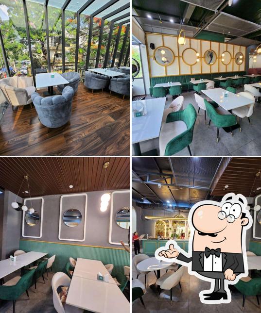 Take a seat at one of the tables at CENTRAL RESTAURANT AND CAFE