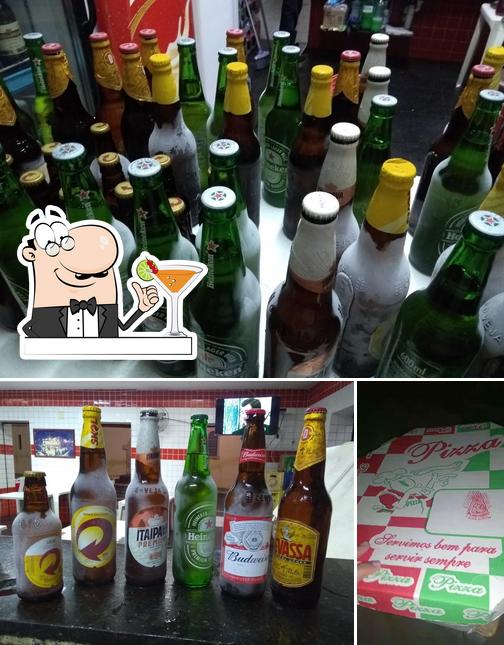 A foto do Pizzaria e Churrascaria Matriz’s bebida e bolo