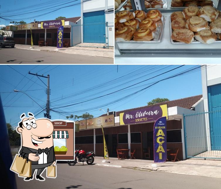 A ilustração a Padaria e Confeitaria Oliveira’s exterior e comida