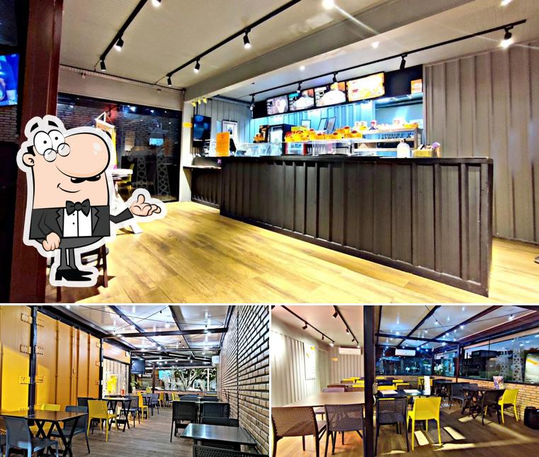 Sente em uma das mesas no Giraffas Container Lucas Rio Verde