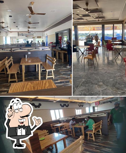 Take a seat at one of the tables at NALLAMMAL GRAMIYA VIRUNTHU