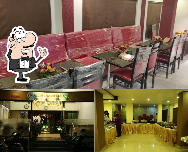 Take a seat at one of the tables at NAKSH BANQETS AND RESTAURENT