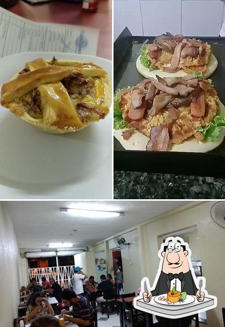 A imagem da comida e interior no Candango Lanches