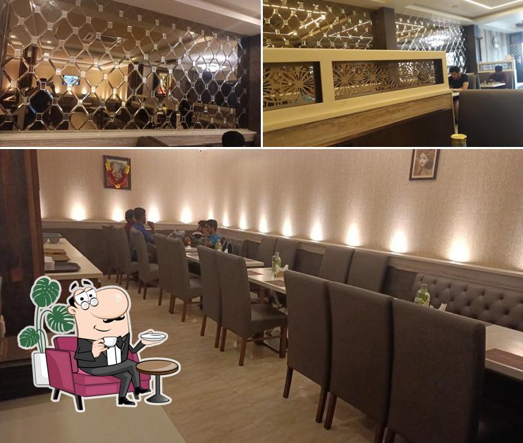 Take a seat at one of the tables at Swarnamukhii Restaurant