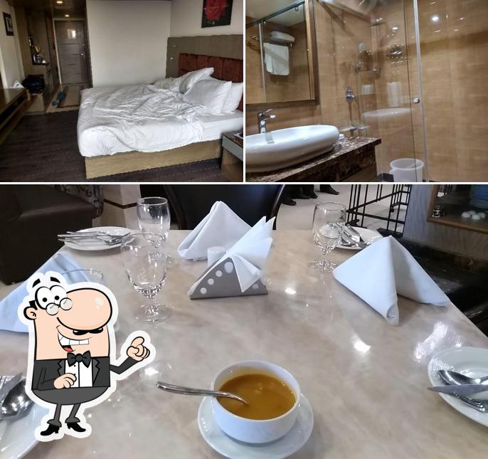 Take a seat at one of the tables at Hotel Benzz Park