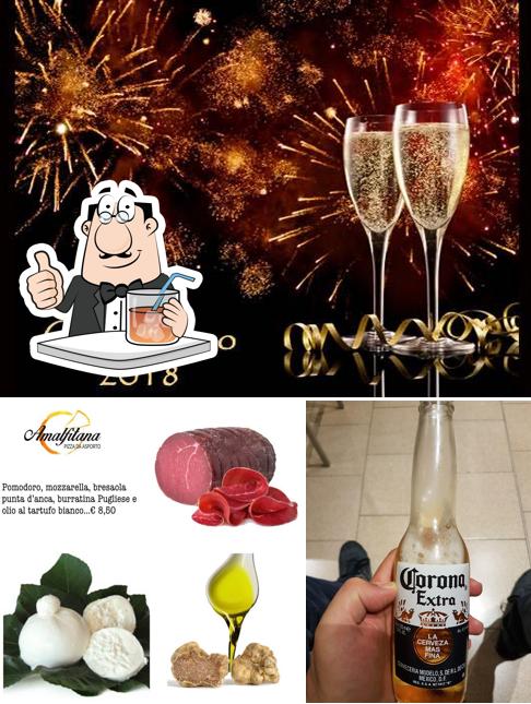 Questa è la foto che raffigura la bevanda e cibo di Amalfitana Snc Di Massimo Nicola e C