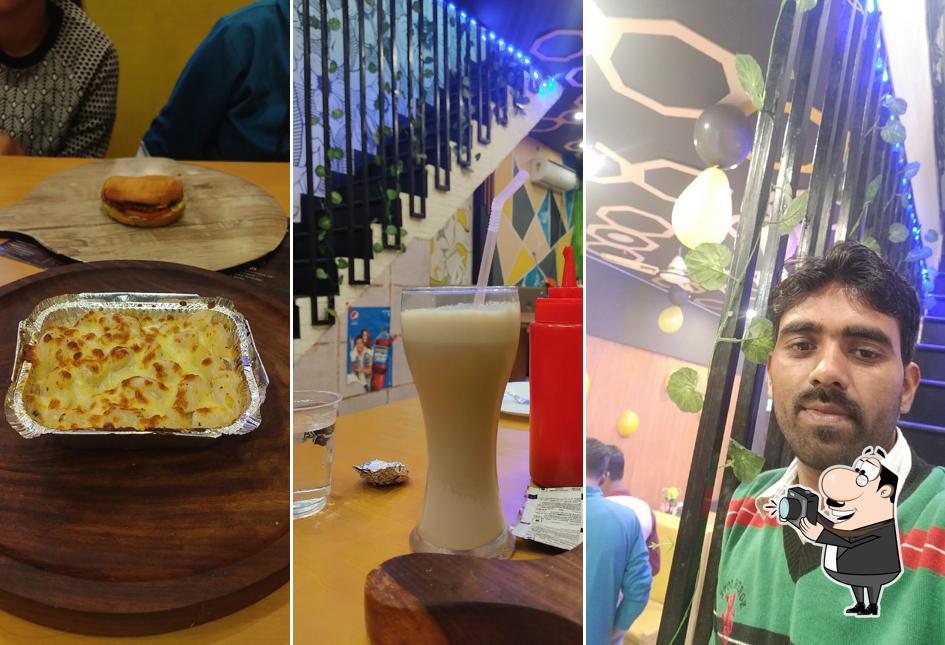 Here's a picture of KT SKy Pizza & Resturent Pratapgarh - Cheering Chair