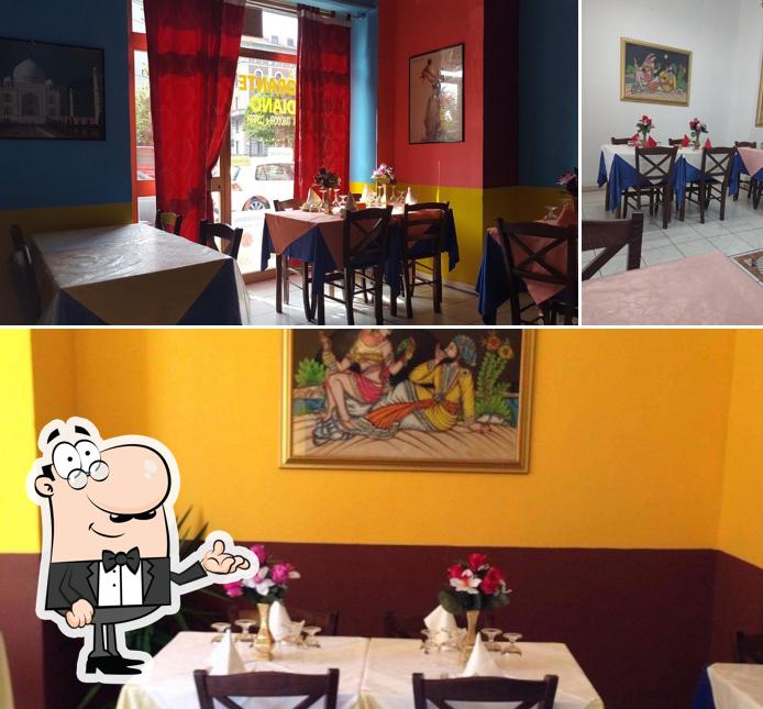 Gandhi Ristorante Indiano si caratterizza per la interni e tavolo da pranzo