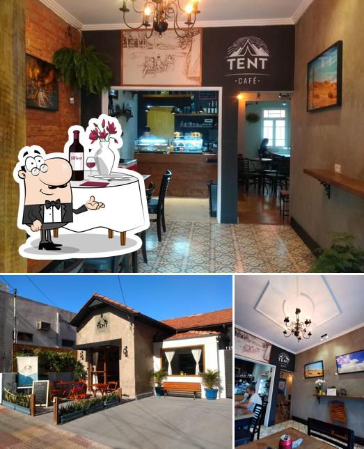 A imagem do TENT CAFÉ’s mesa de jantar e exterior
