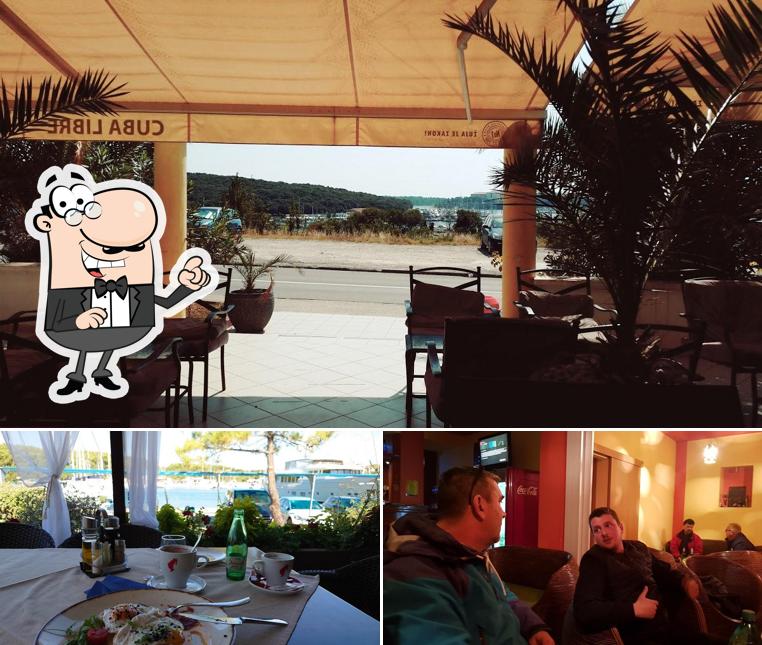 Siediti a un tavolo di Caffe bar Cuba Libre